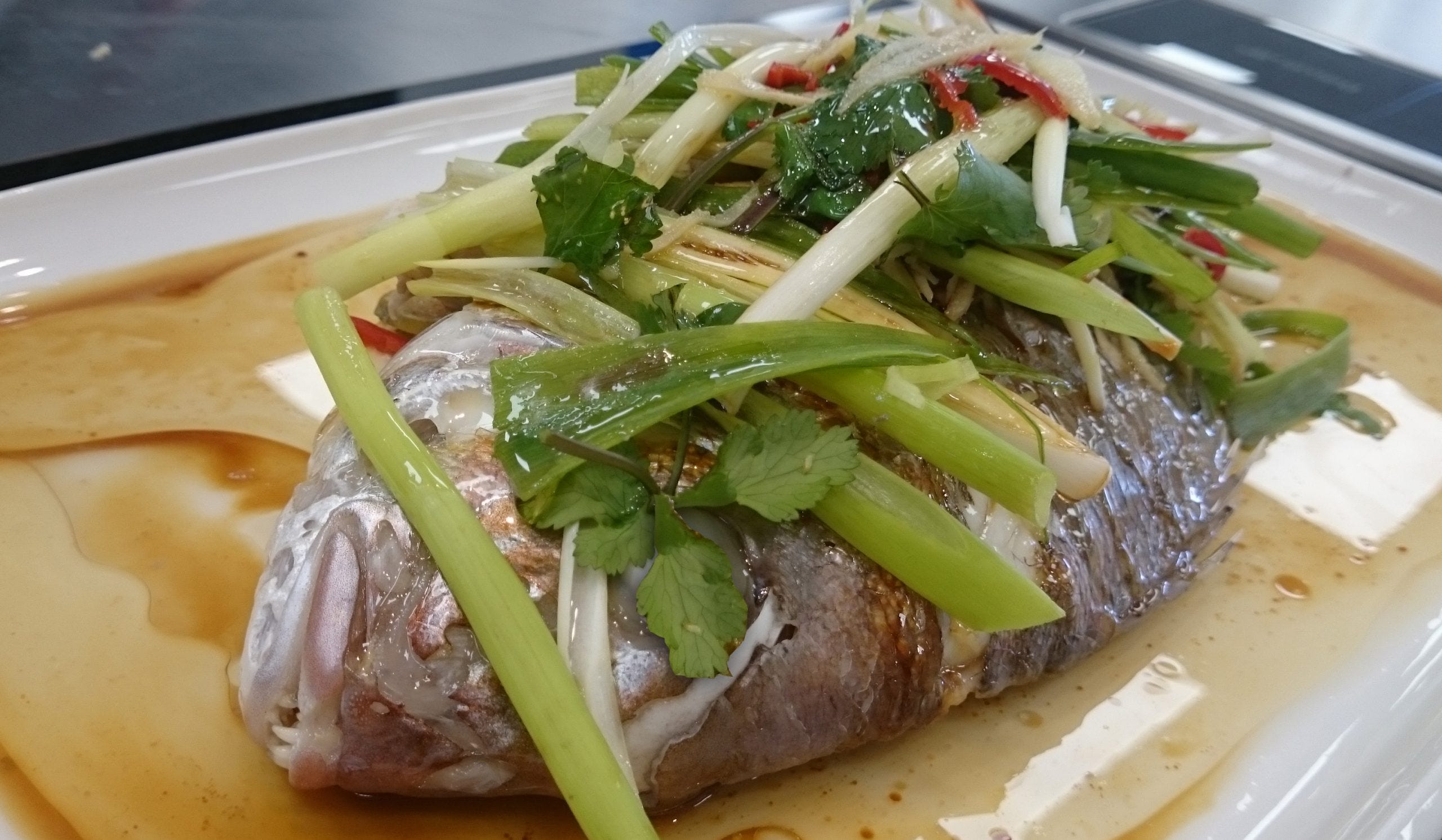 Asian Inspired Steamed Whole Snapper with Spring Onions and Ginger